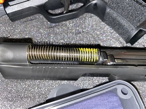 This system manages recoil to run the P365s shorter slide. . Sig p365 recoil spring problems